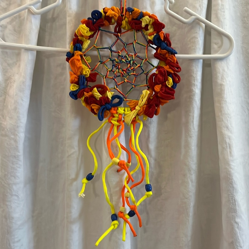 Dream catcher / nylon loops on metal hoop. Multi color string for center